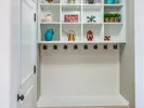 A mud room with built in shelves