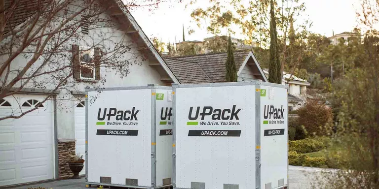 upack_moving_relocubes_sitting_in_residential_driveway