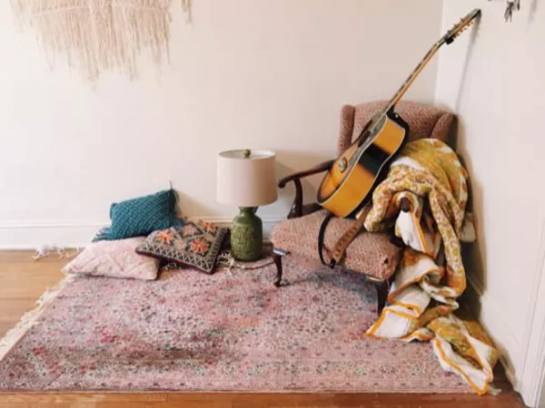 Image of guitar ready to play goodbye songs in a house being packed for a move.