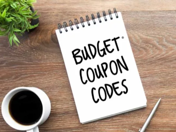 Notepad with &quot;Budget coupon codes&quot; written on it.