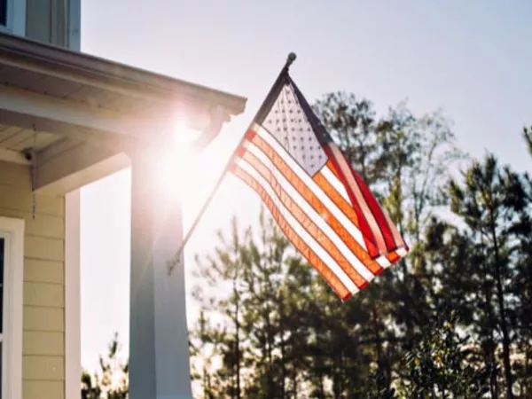 American flag on front porch post, symbolizing moving discounts for military members.