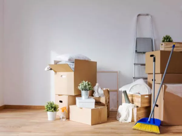 Packing household items after finding the cheapest way to move out of state.