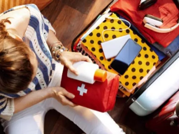 Person packing toiletries for a move.