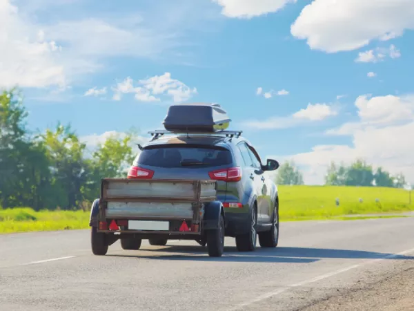 car pulling a trailer during a one-way move