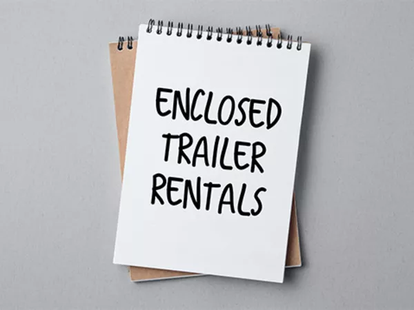 “Enclosed trailer rentals” written on notebook.