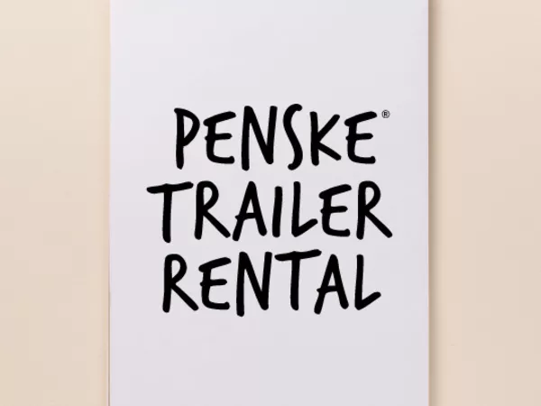 Notepad with text reading "Penske Trailer Rental"