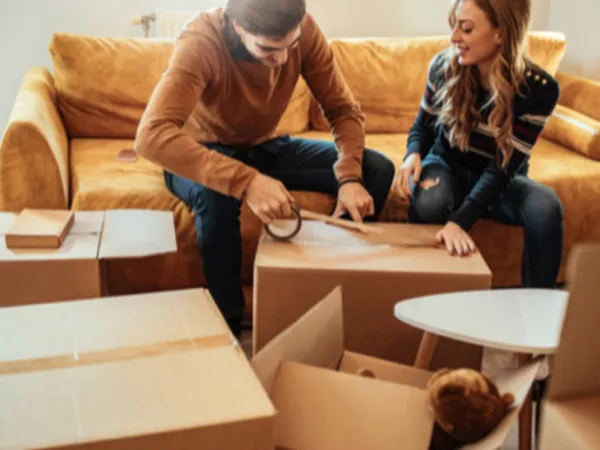 Couple packing boxes for storage.