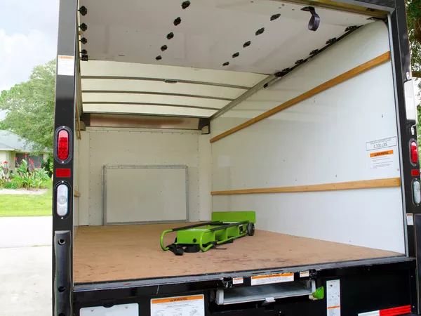 Inside of an empty moving truck.