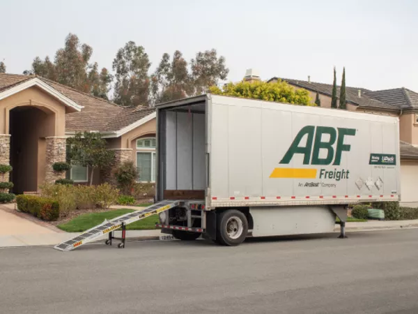 A U-Pack trailer parked on a street, ready for an out-of-state move.