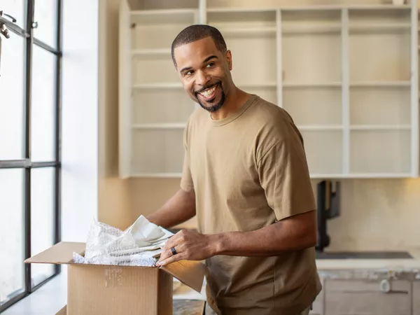 A soldier uses a military moving guide to prepare for a move after receiving PCS orders.