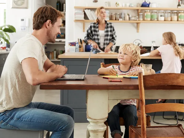 A family sits in a kitchen while the mother contemplates moving to a new place.