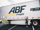 girl posing in front of upack moving trailer