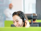 upack customer service representative smiling while on the phone