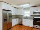 Updated kitchen with stainless steel appliances.