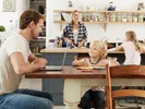 A family sits in a kitchen while the mother contemplates moving to a new place.