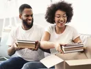 couple putting books in box